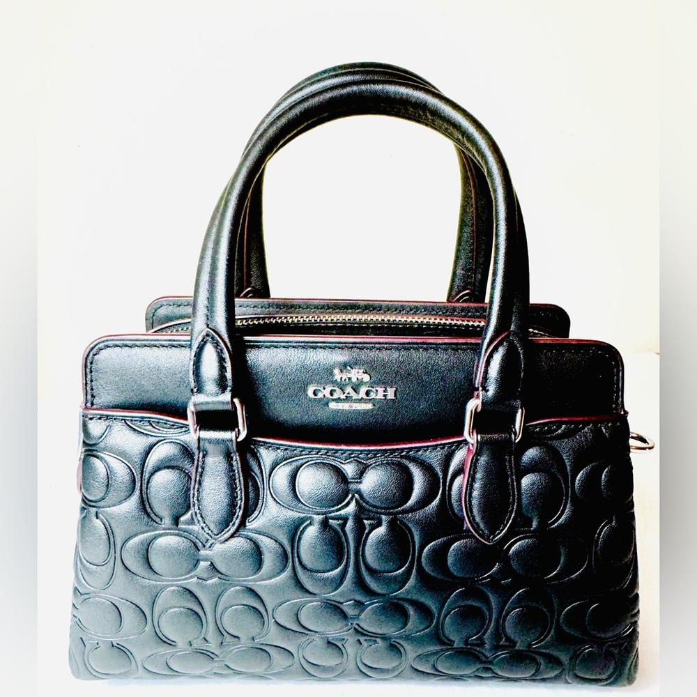 Coach Mini Darcie Carryall Bag
In Blocked Signature Canvas Black